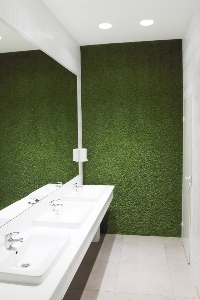 image of artificial grass installed up a wall in a bathroom