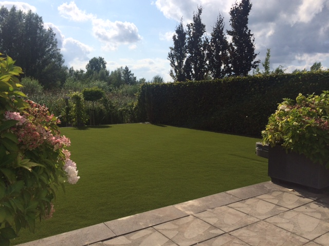 fake grass installed in ack garden with patio